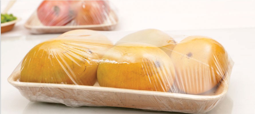 Areca leaf tray holding fruit